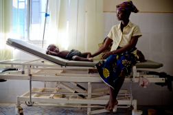 Photo of a woman and baby on a hospital bed