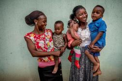 Picture of two women holding children